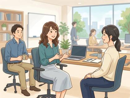 オフィスで同僚たちが会話や打ち合わせをしている様子。