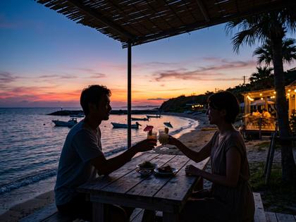 沖縄の海沿いカフェでドリンクを楽しむ男女のシルエット