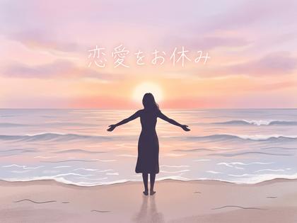 海辺で一人、風を感じながら立つ女性の後ろ姿